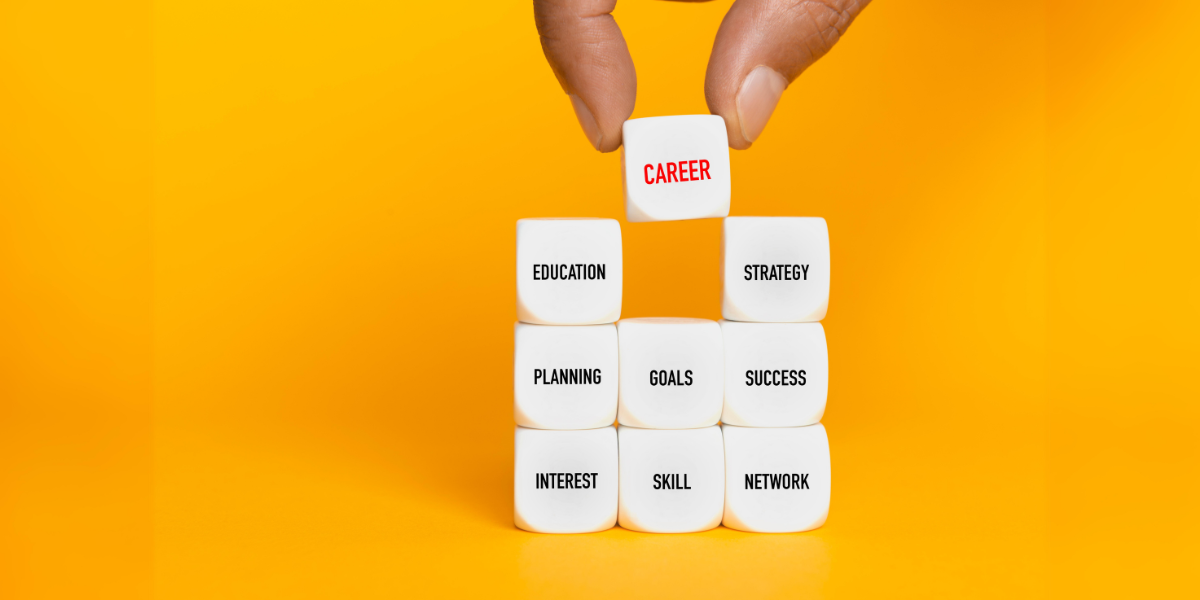A block of dice reading Education, Strategy, Planning, Goal, Success, Interest, Skill, Network and Career