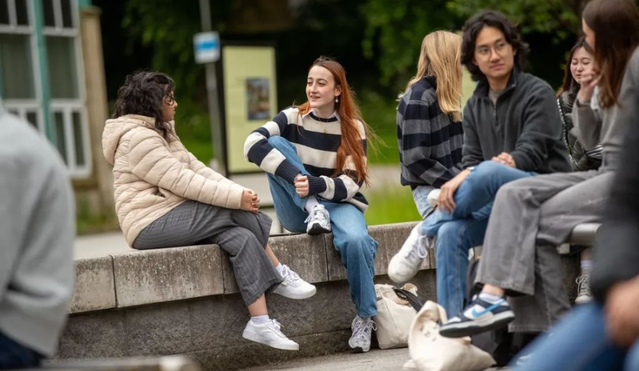 Students chatting outside on campus
