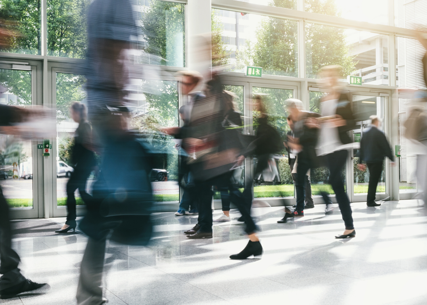 Motion-blur of people walking down a busy street