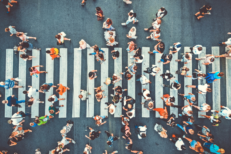 People walking across a pedestrian crossing