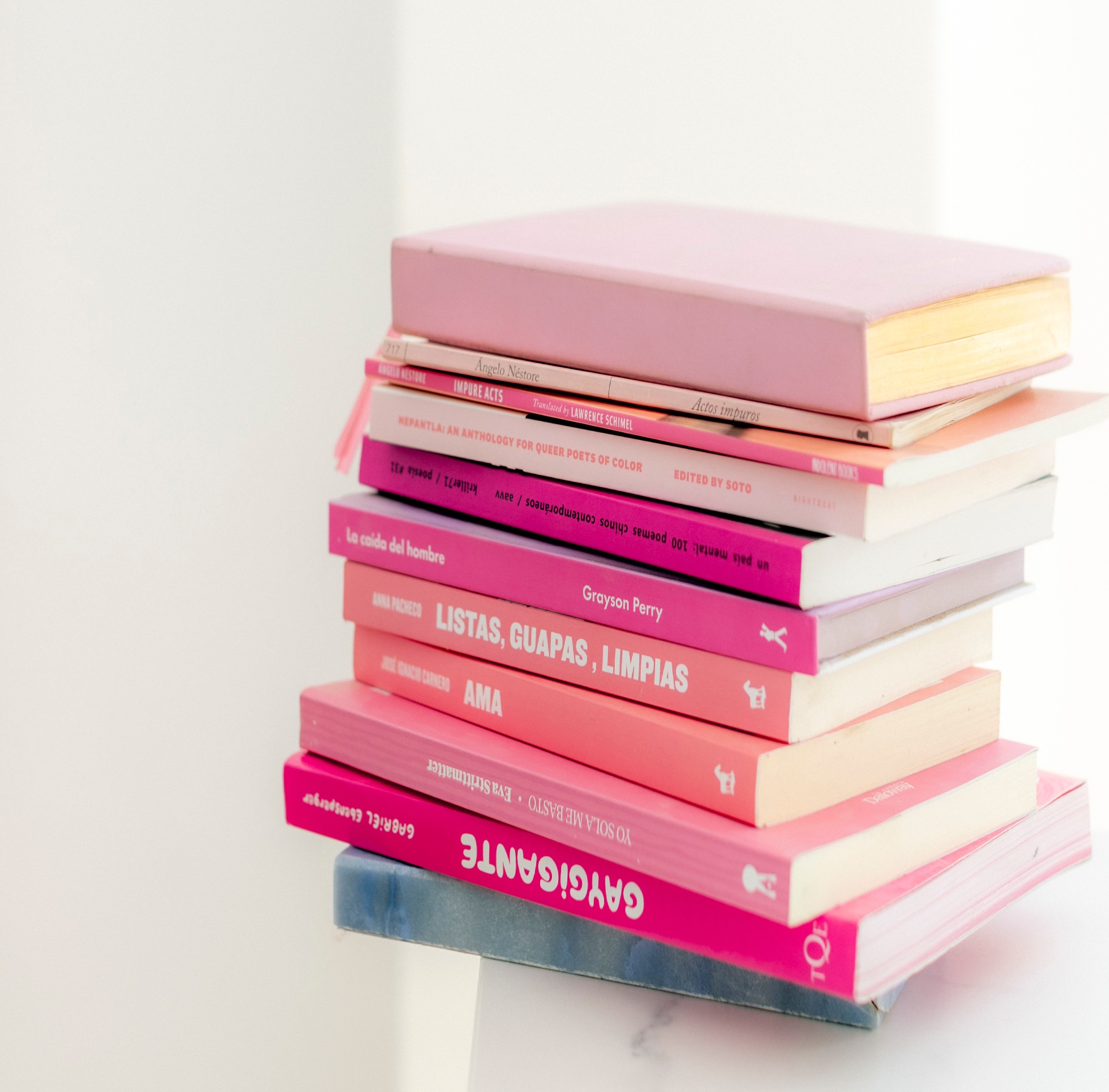 Pink books stacked