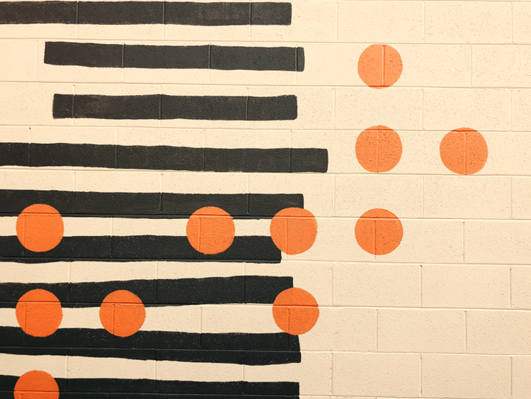 orange dots on striped wall