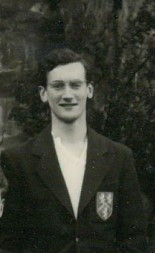 A black and white photo depicting Robin Stoddart as a student, wearing his college blazer
