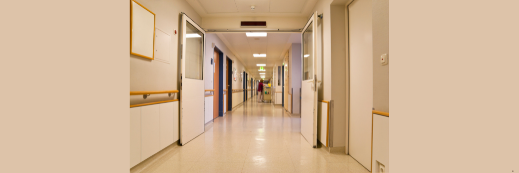 Looking down a hospital ward.