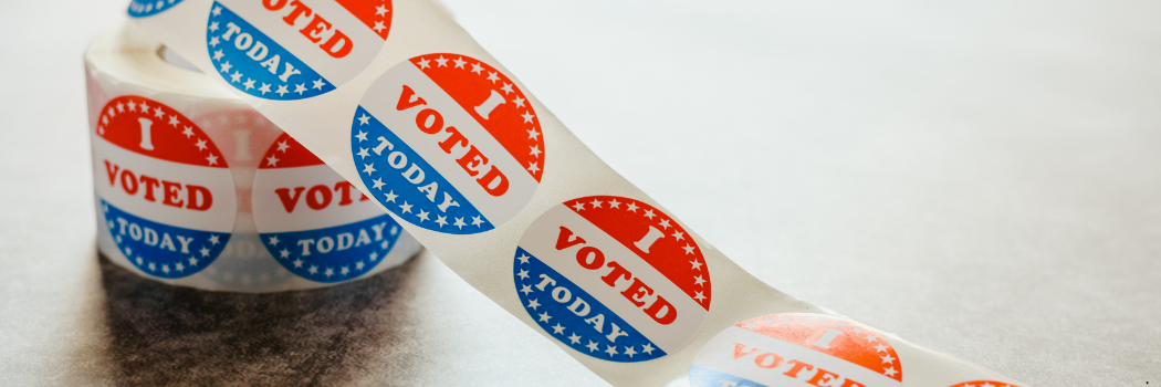 A reel of red white and blue stickers saying I voted today