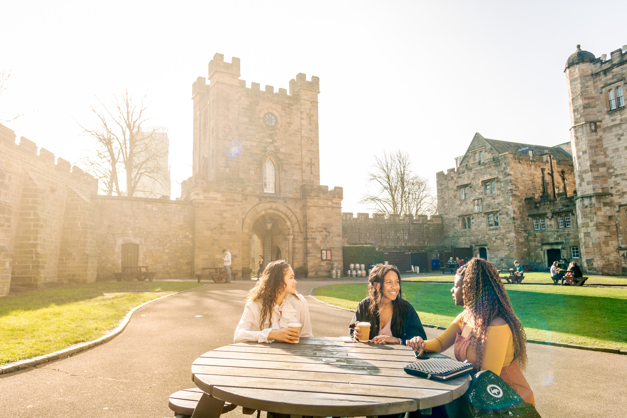 Three international students sat talking