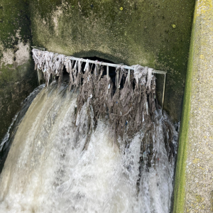 Water gushing out of an outflow pipe