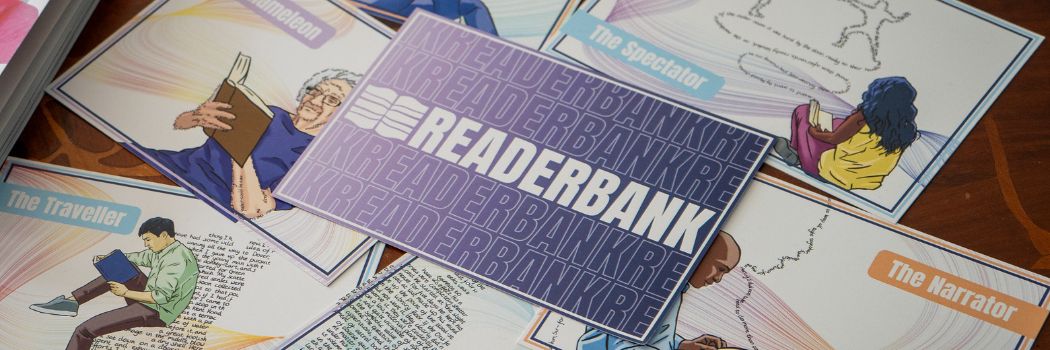 Cards scattered on a table with the central card reading ReaderBank