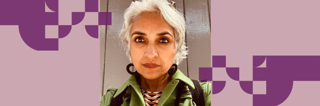 Professor Nayanika Mookherjee wearing a green top looking seriously at the camera