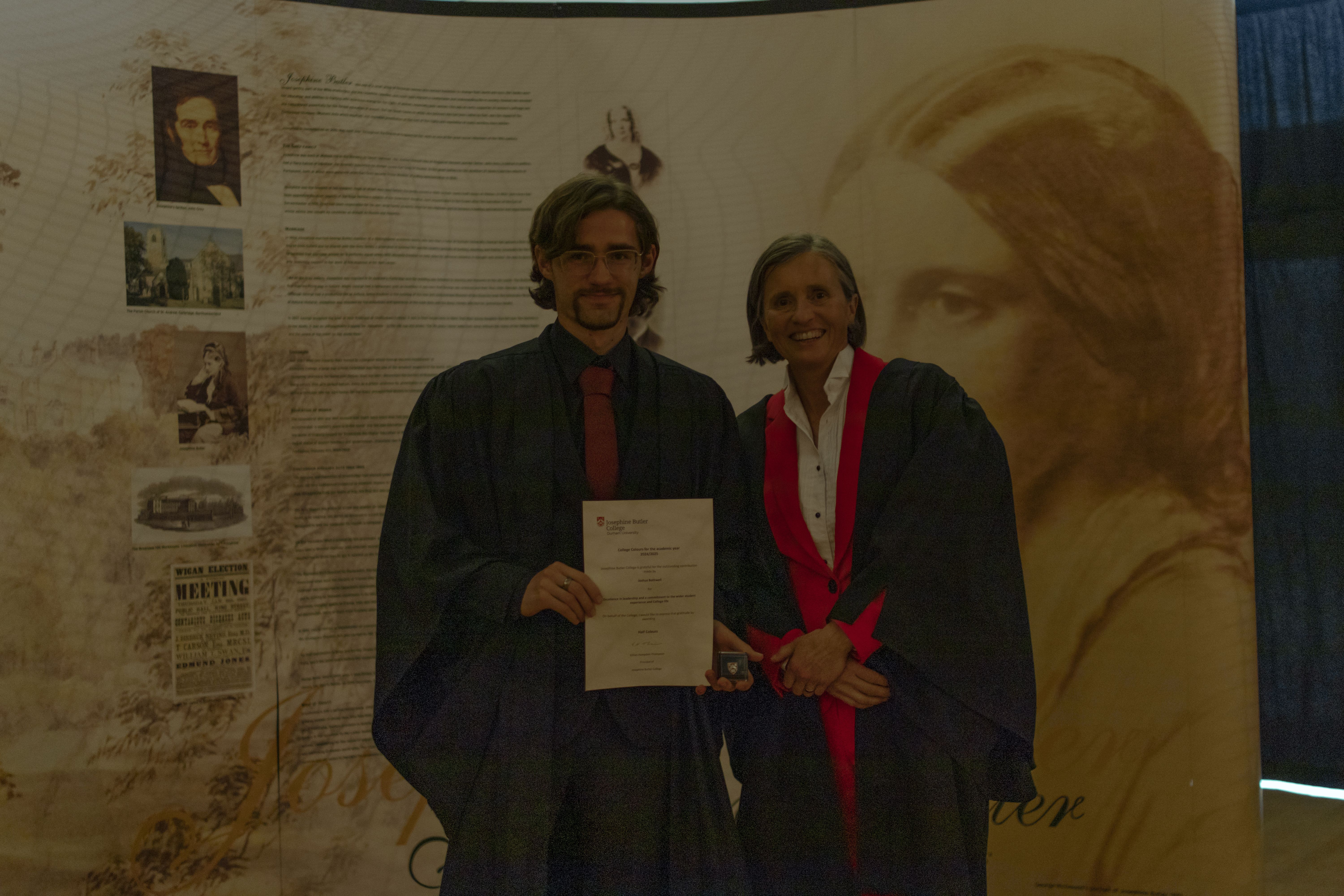 student receiving colours