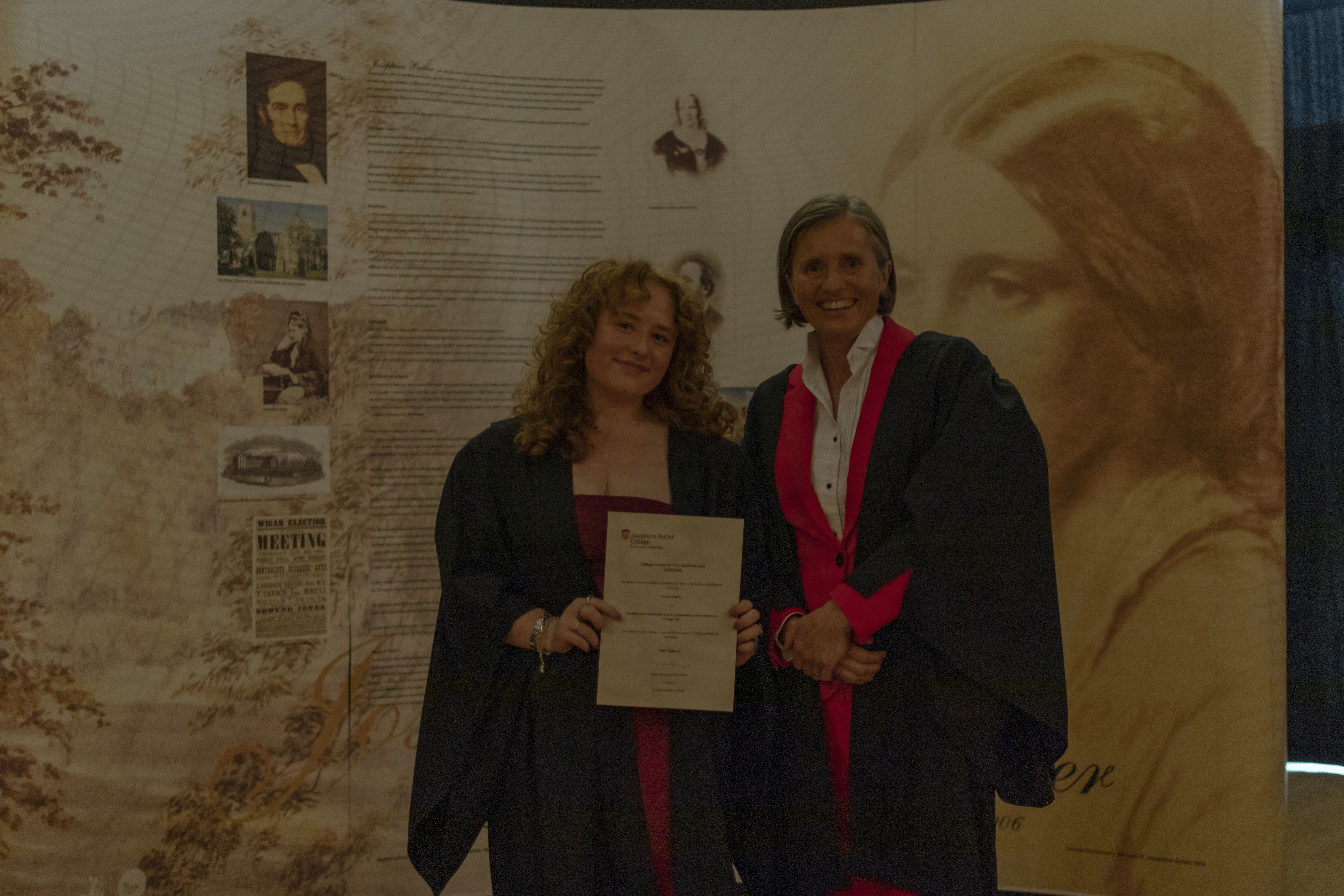 student receiving colours