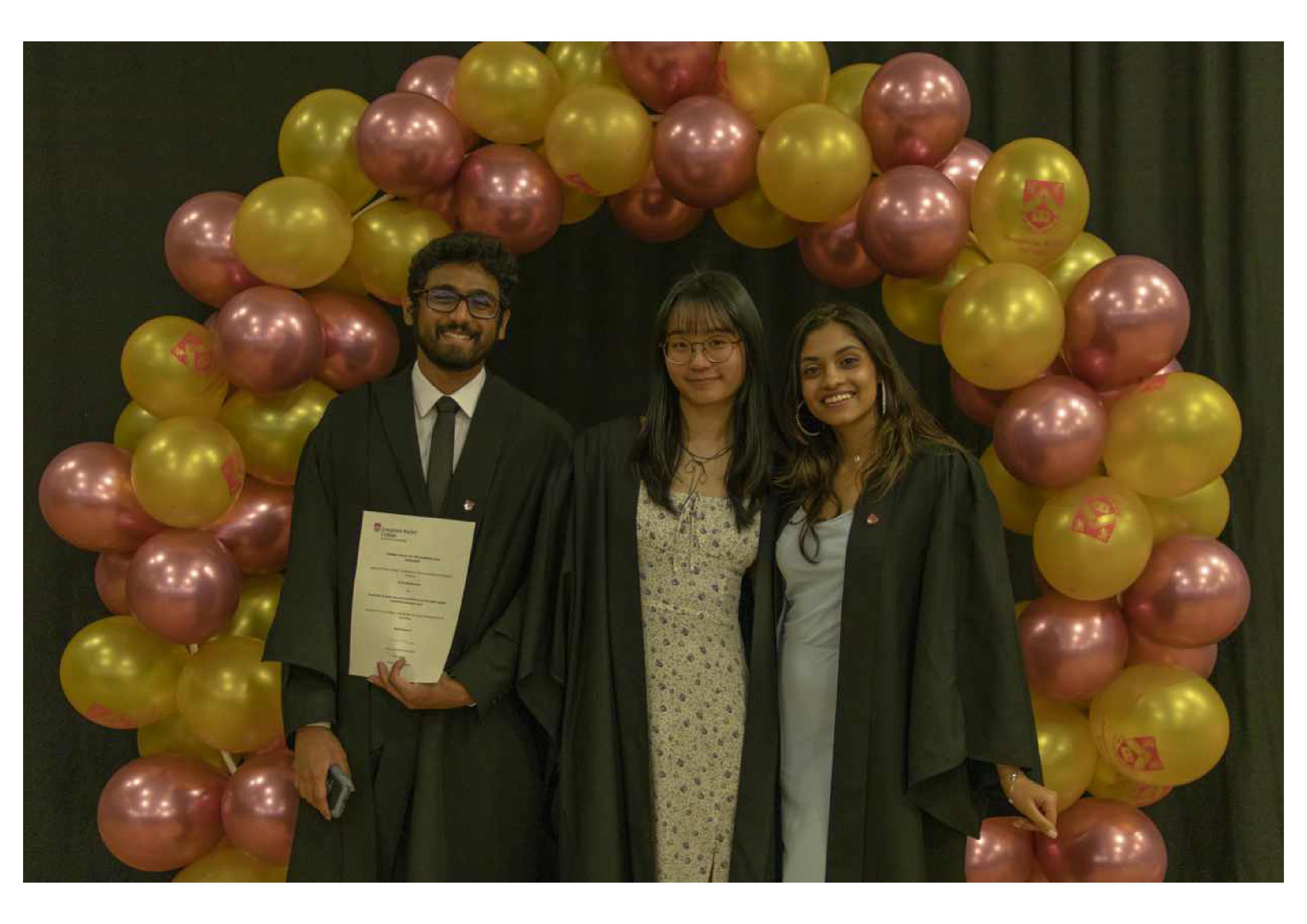 3 students in front of balloon arch at Colours Formal 2025