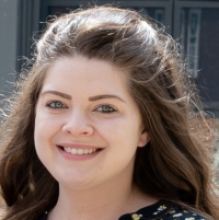 Member of staff smiling