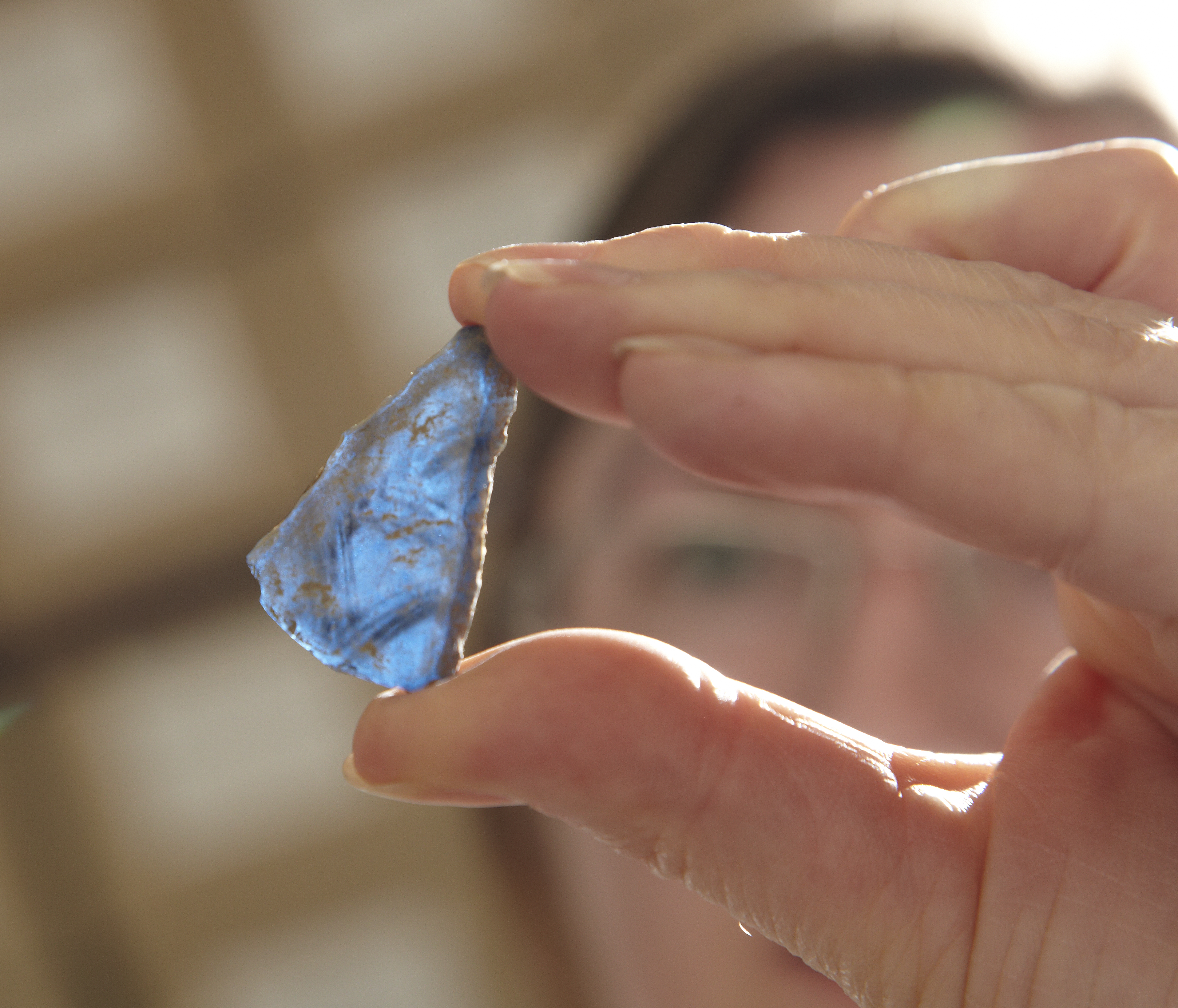 Someone holding a piece of stone