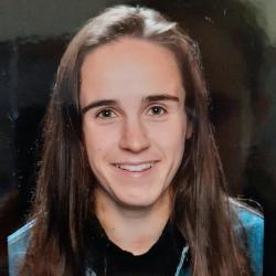 Profile photo of former Durham University student Ellie Jones, against a black backdrop.