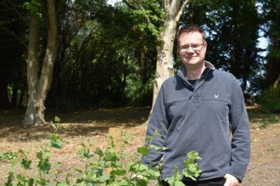 Prof Mike Church on a sunny day at the Botanic Garden, Durham University