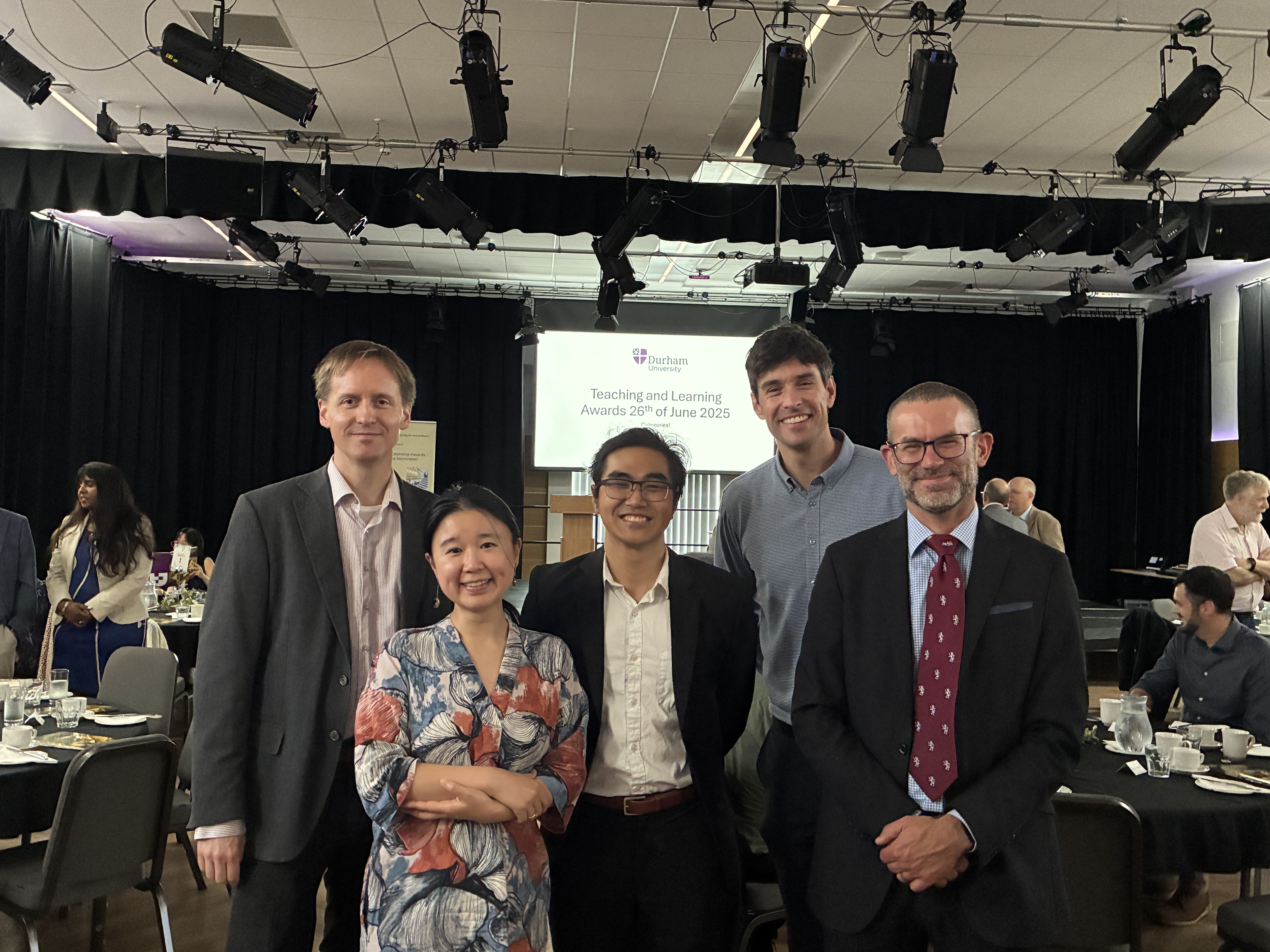 Five members of the music department at an awards ceremony