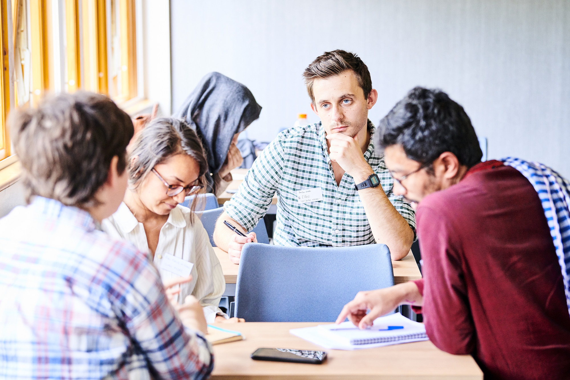 A group of students discussing their thoughts