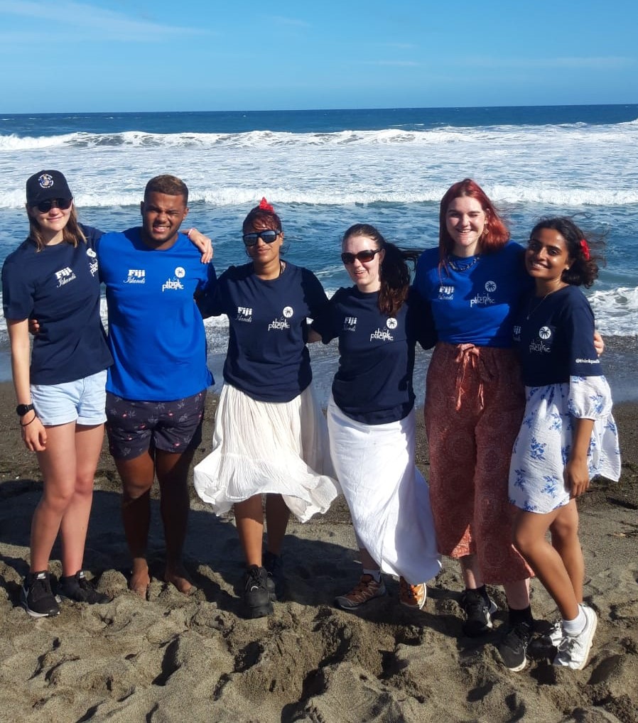 A group of students on a beach