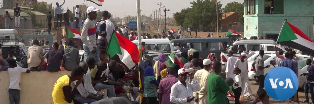 Protestors take to the streets in Sudan, waving Sudanese flags