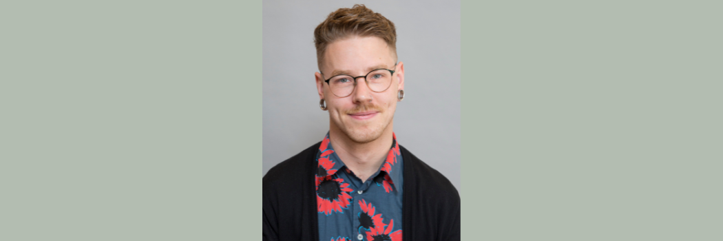 Dr Travis LaCroix is pictured against a plain background