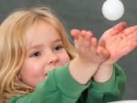Kid with table tennis ball