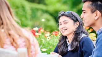 Students at a table in the botanic garden