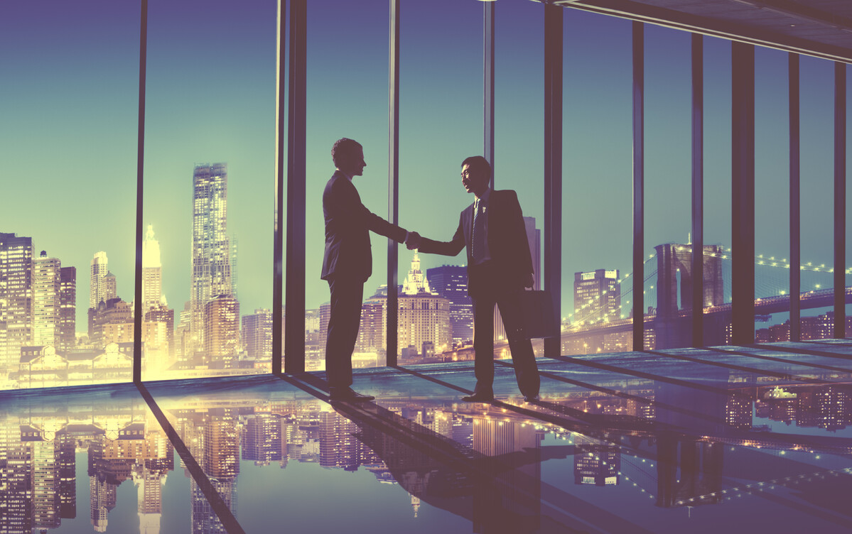 Business handshake in front of city skyline, for result corporate law