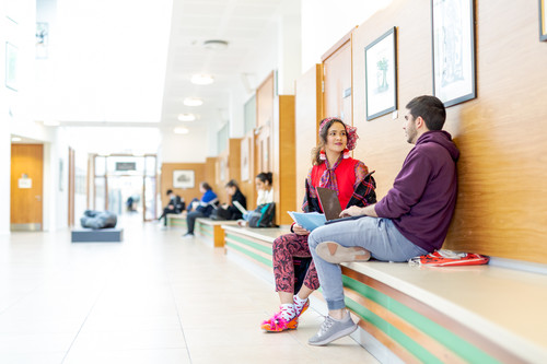 Two students sat talking