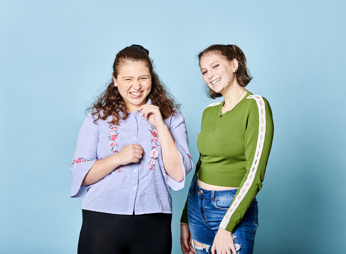Two students on blue background